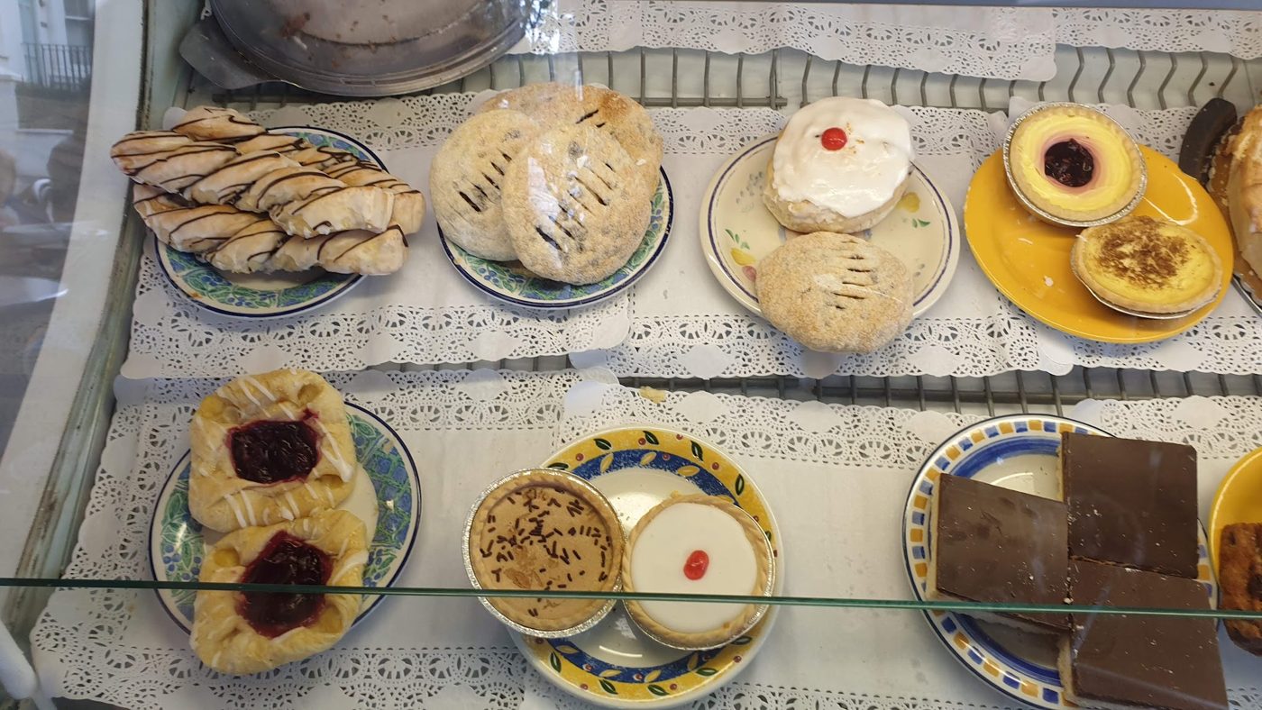 Pastries, jam tarts and cakes on plates